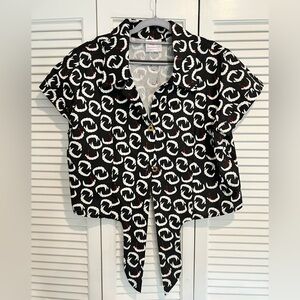 Button up top with vampire teeth